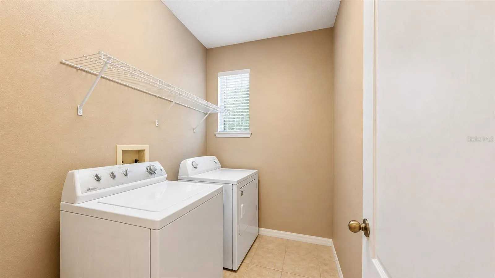 Spacious laundry room next to the garage.