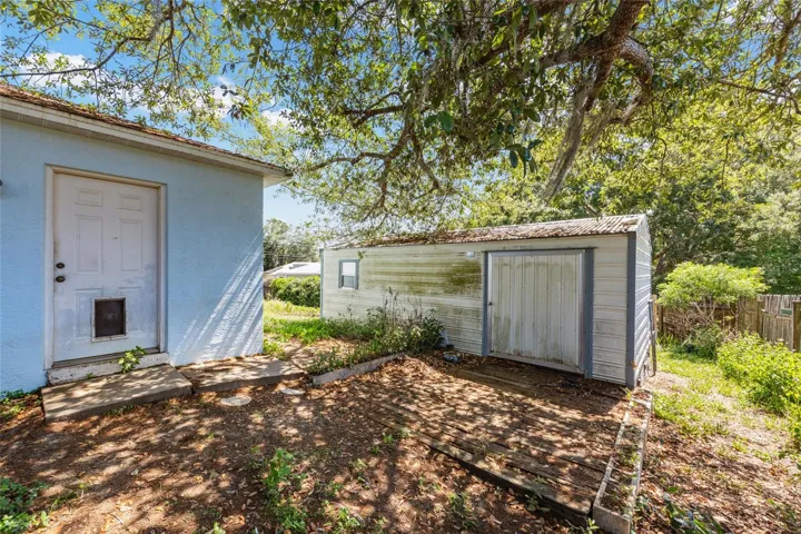 Door to Garage, Storage Shed (Conveys with home)