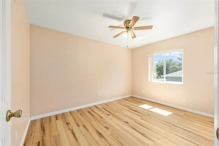 Bedroom 3 with Window to Backyard