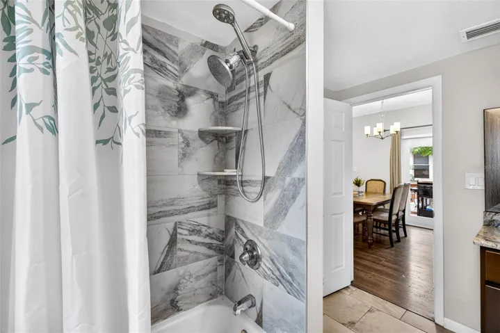 Floor to ceiling tiled guest shower
