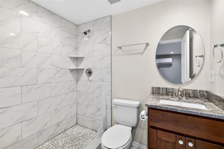 Guest apartment bathroom with floor to ceiling tile