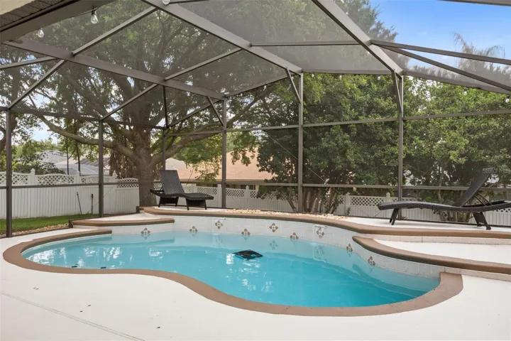 Pool with screen enclosure.