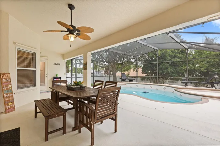 Pool with covered lanai, and screen enclosure.