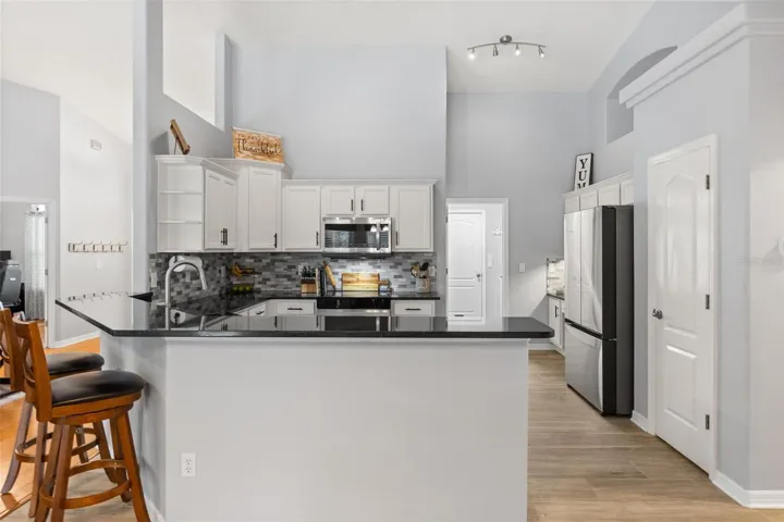 Upgraded kitchen with breakfast bar.