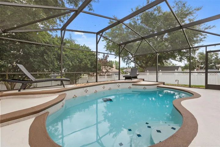 Pool with screen enclosure.