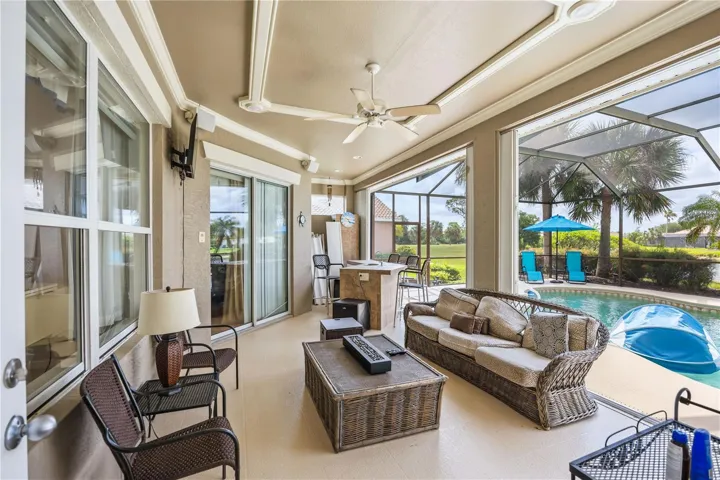 Covered pool area. Bar has sink and room for a small refrigerator and a grill.