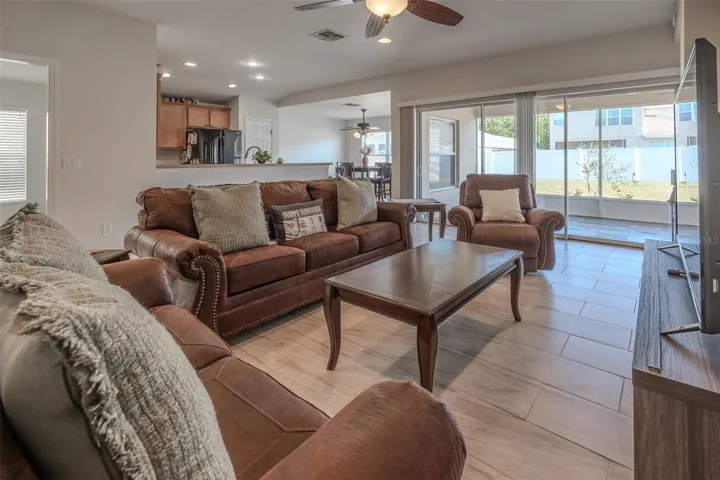 Large living room overlooks screened lanai.