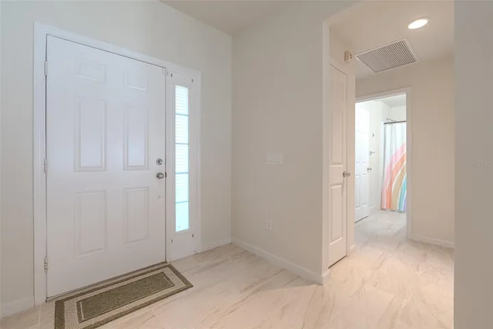 View of front entry door and Hallway of Bedrm 2