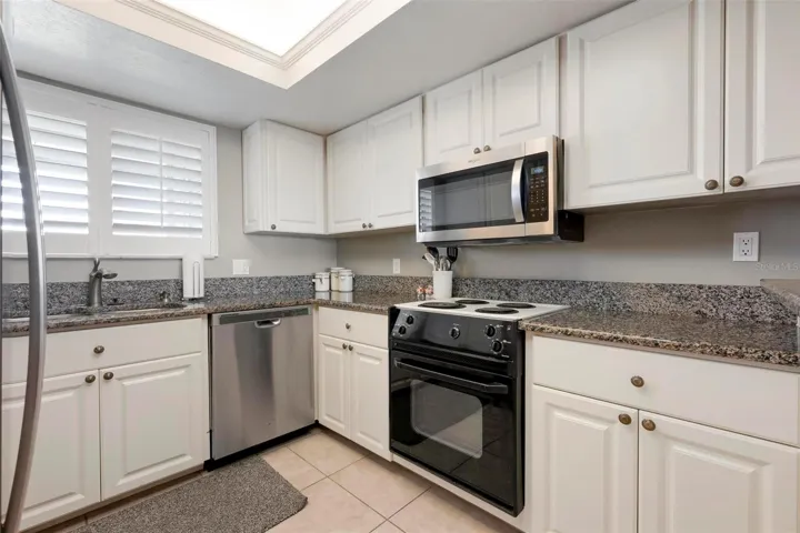 Bright updated kitchen with granite counter tops.
