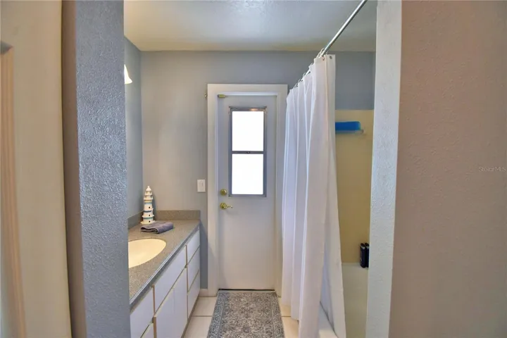 Hall/Guest Bath that leads to the pool area