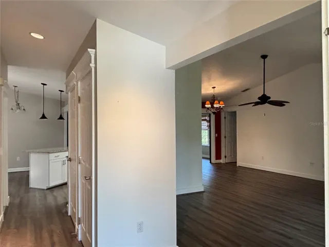 front entry to the right is the livingroom to the left hall leads to kitchen and family room