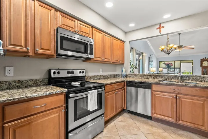 Updated kitchen with newer SS appliances and granite countertops.