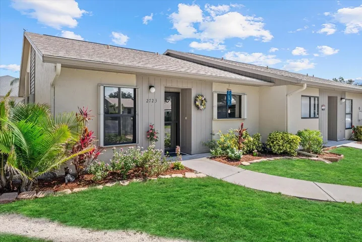 End unit with a large side yard.