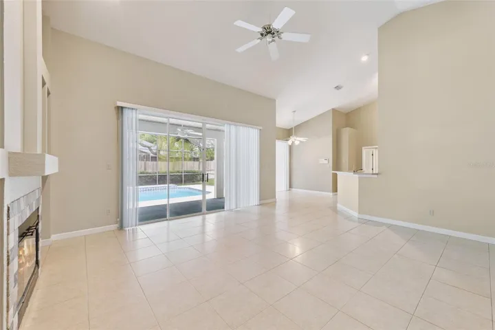 Family Room overlooking the pool area and kitchen eating space