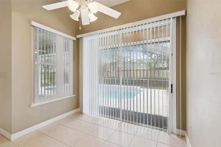 Kitchen eating space area with view of pool