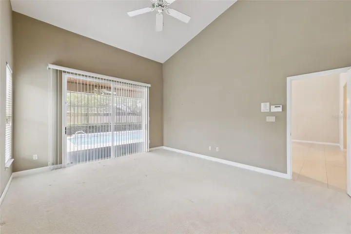 Primary bedroom with view of pool