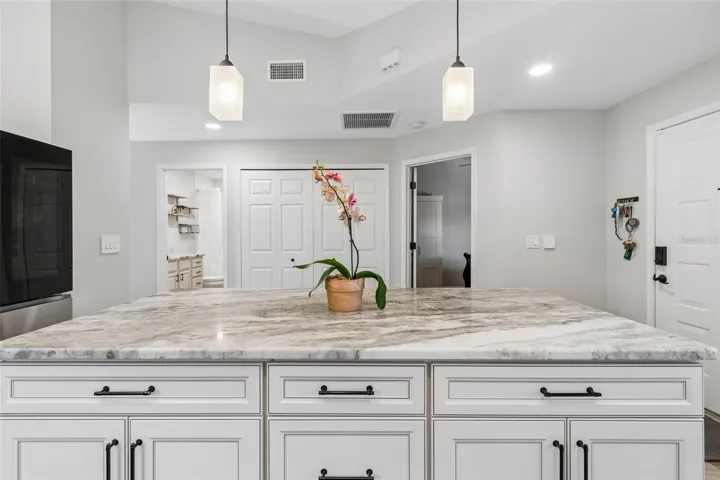 Custom island with granite and cabinetry