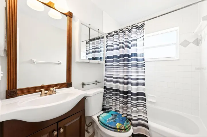 Two additional bedrooms and another full bath provide flexibility for guests, family, or a home office.