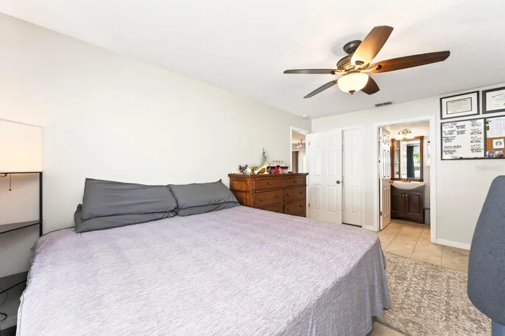 The Primary retreat features a walk-in closet and a beautifully UPDATED MODERN EN SUITE BATH.