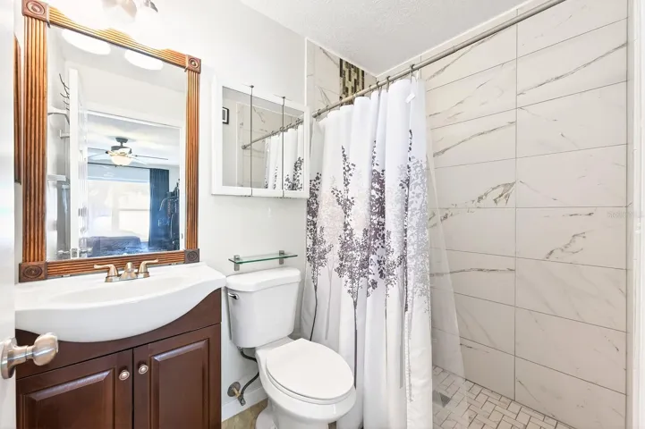 The Primary retreat features a walk-in closet and a beautifully UPDATED MODERN EN SUITE BATH.
