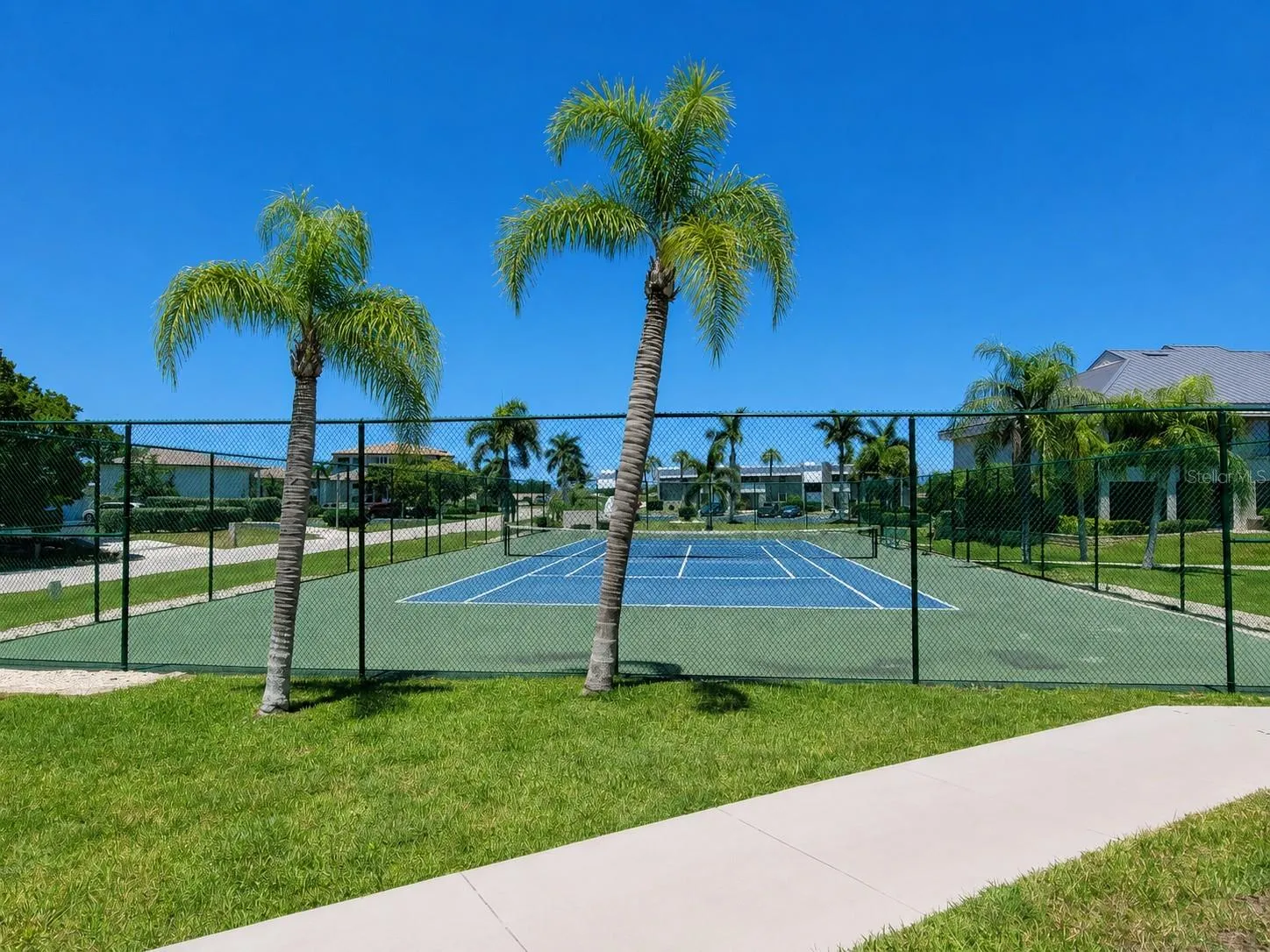 Private tennis court just steps from your door