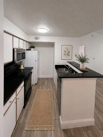 The  photos have been virtually staged and/or digitally enhanced using AI for marketing purposes only. Furniture, décor, and other staged items shown in the images are not included with the sale or lease of the property.