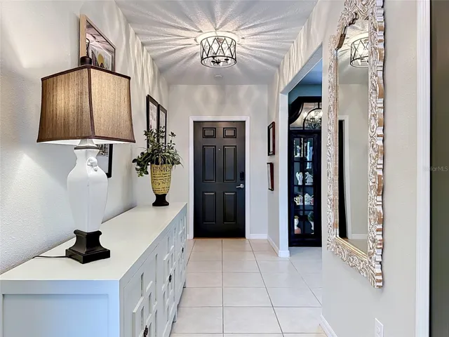 Welcoming foyer entry with updated lighting