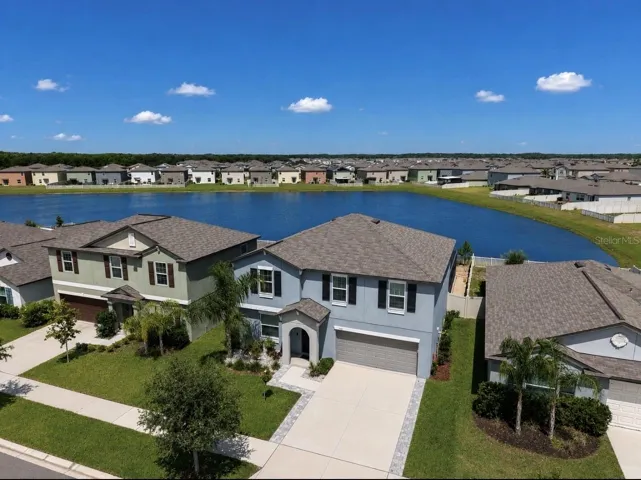 Beautiful 2023-built 4-bedroom, 2.5-bath home with a flex room, bonus loft, heated saltwater pool and spa, and serene pond views