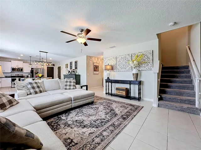 Open-concept living, dining, and kitchen area