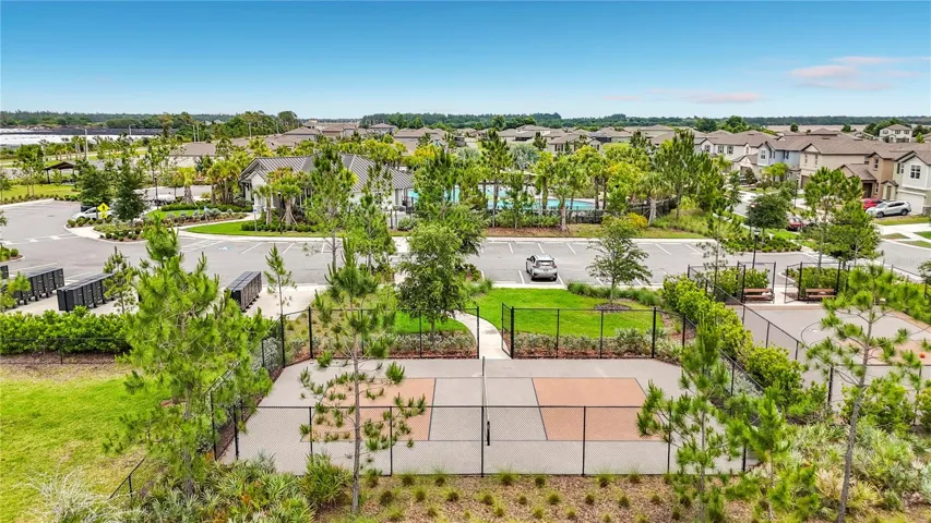 Berry Bay's resort-style amenities include a zero-entry pool, clubhouse, picnic areas, dog park, playground, basketball courts, and pickleball courts.