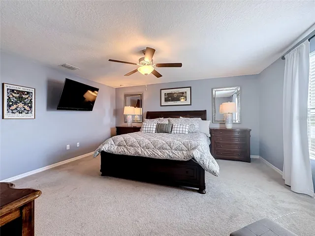 Private primary bedroom retreat with en-suite bathroom and oversized walk-in closet