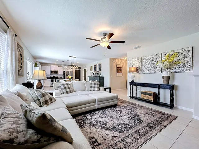 Open-concept living, dining, and kitchen area