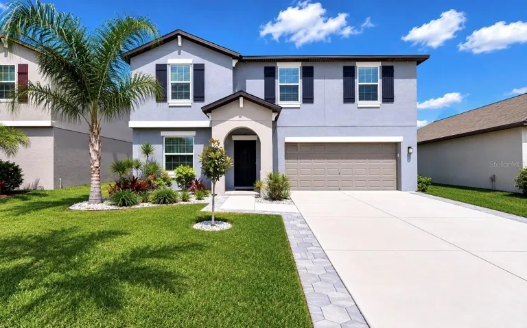 Welcome to 5519 Blue Azure Drive, a beautifully upgraded 4-bedroom, 2.5-bath home featuring a versatile flex room, spacious bonus loft, and a stunning heated saltwater pool and spa overlooking peaceful pond views—offering the perfect blend of comfort, style, and Florida living!