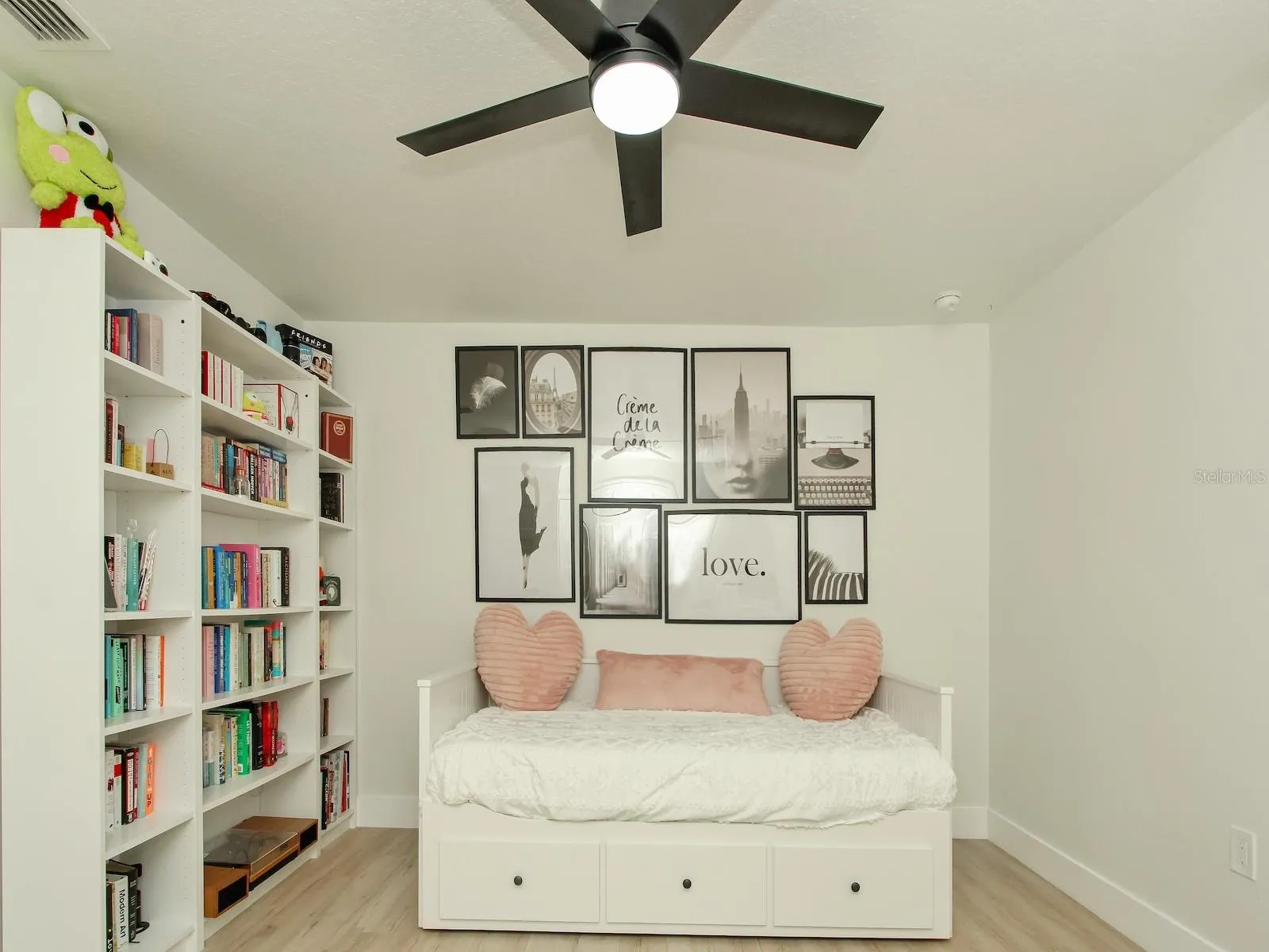 1 of 5 bedrooms this is the quest quarters which sports a library and a remote control fan
