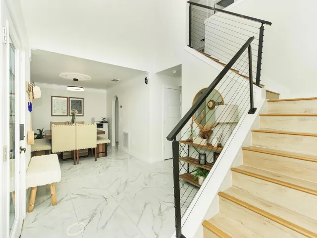 The stairs are decorated with a steel banister giving you a modern touch to the design