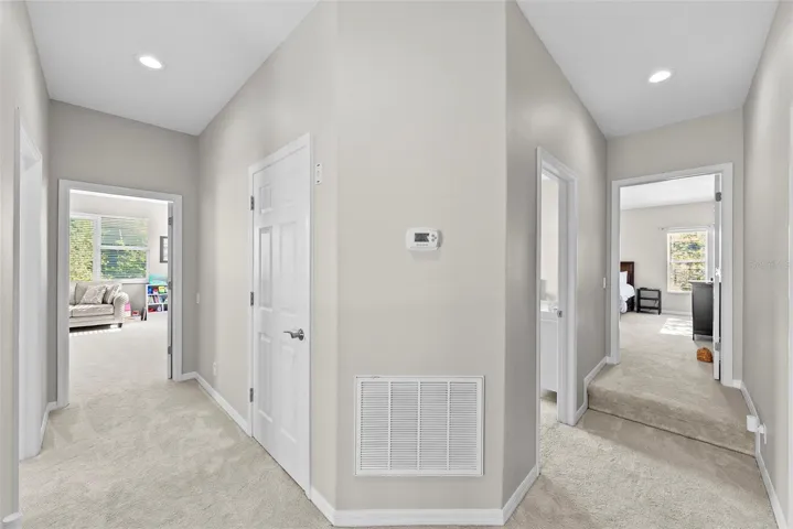 Upstairs hallway with bonus room to the left and bedrooms to the right.