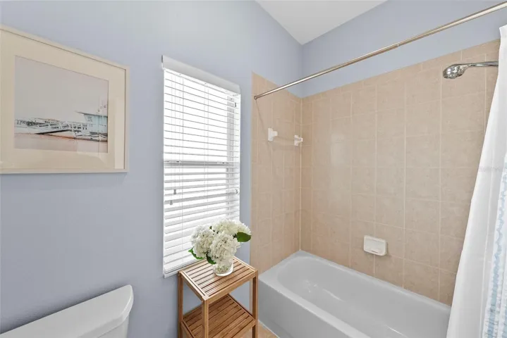 Hall bath commode and tub/shower.