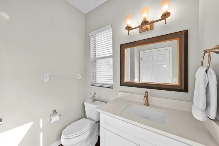 Half bath off the living room and door to the pool.