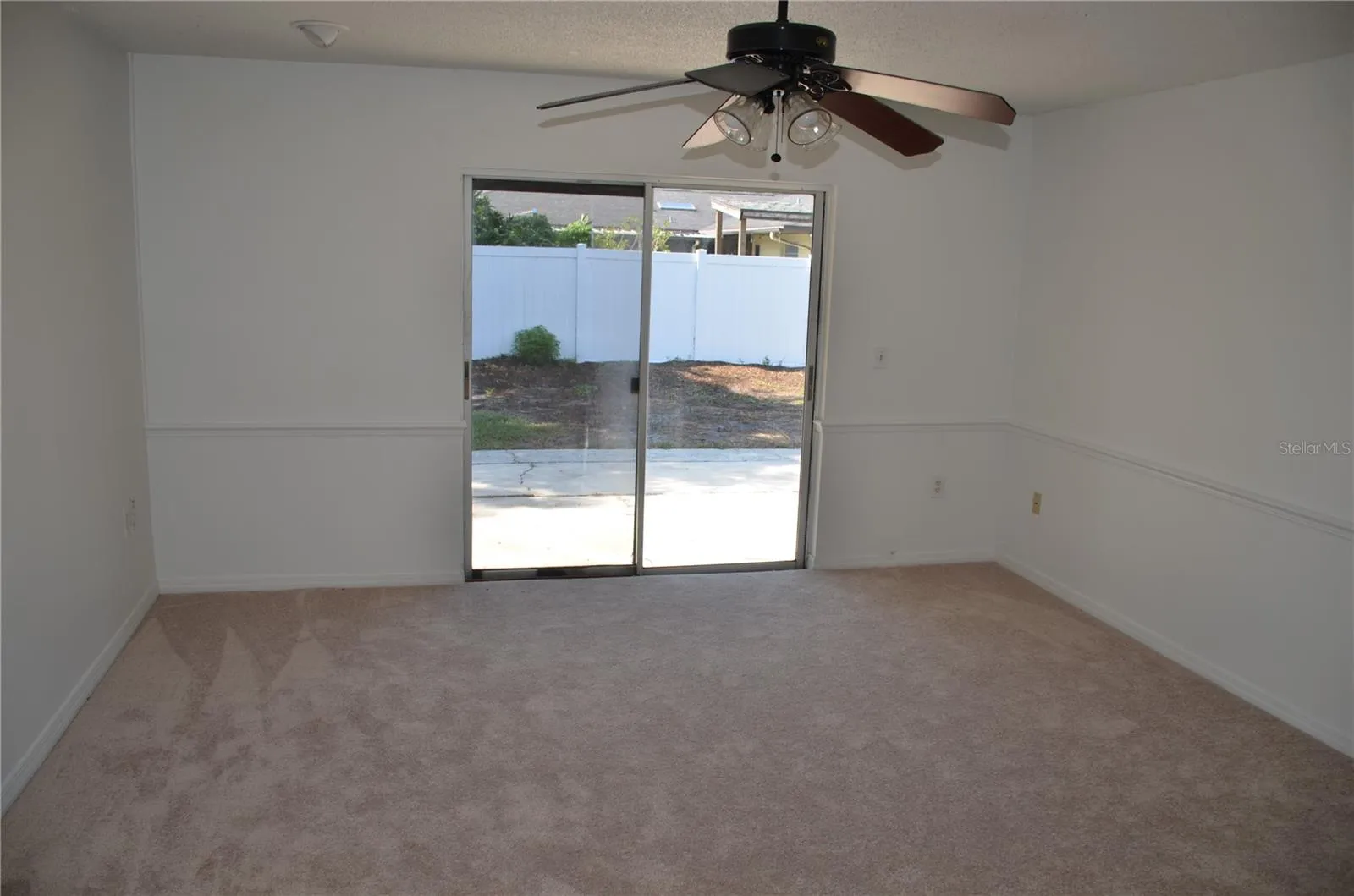 Family Room with fence in the Backyard
