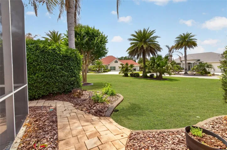 THE RIGHT SIDE OF THE LANAI - NICE LARGE CORNER LOT.