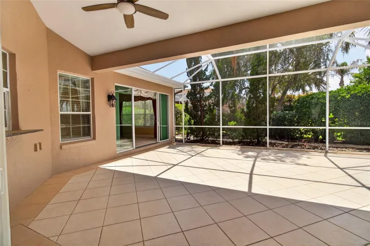 PASS THROUGH FROM THE KITCHEN IS ON THE FAR LEFT - THESE SLIDING GLASS DOORS LEAD TO THE FAMILY ROOM.