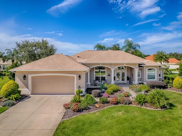 GREAT CURB APPEAL WITH LUSH LANDSCAPING AND STONE CURBING.
