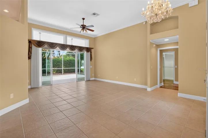 LIVING ROOM AND ENTRANCE TO THE MASTER SUITE ON THE RIGHT.