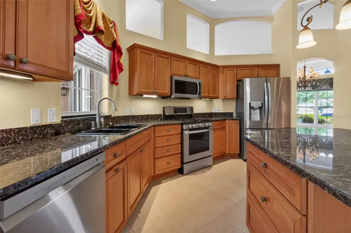 LOVELY CHERRY CABINETRY WITH GRANITE COUNTERTOPS AND STAINLESS APPLIANCES.  NEW BOSCH DISHWASHER.