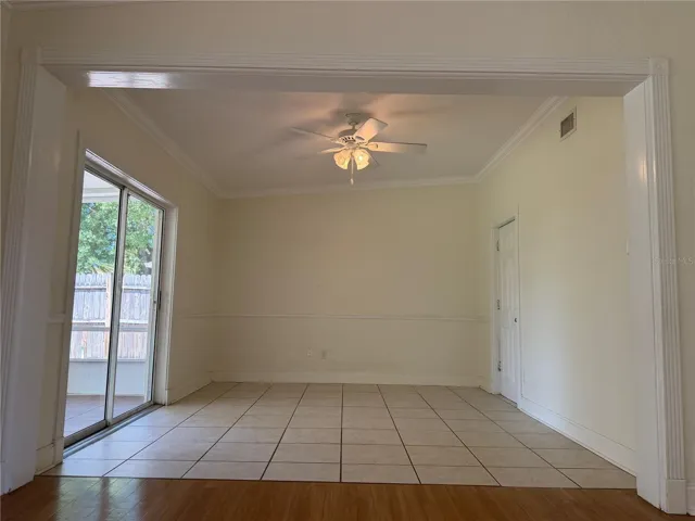 Den with additional sliding doors to lanai and access to utility and laundry room