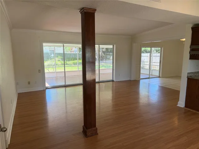 From front door looking into an open and connected kitchen, dining area and living room