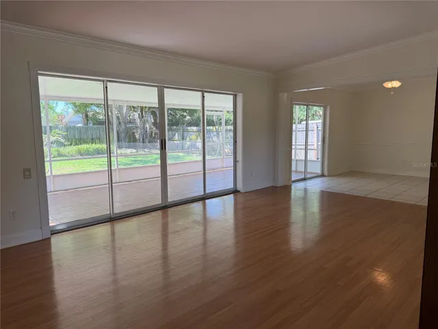 Living room with great natural light from sliding doors open to back lanai