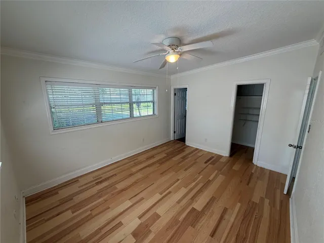 Primary bedroom looking into bathroom and closet