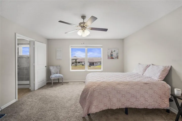 Primary bedroom is spacious with pond views!