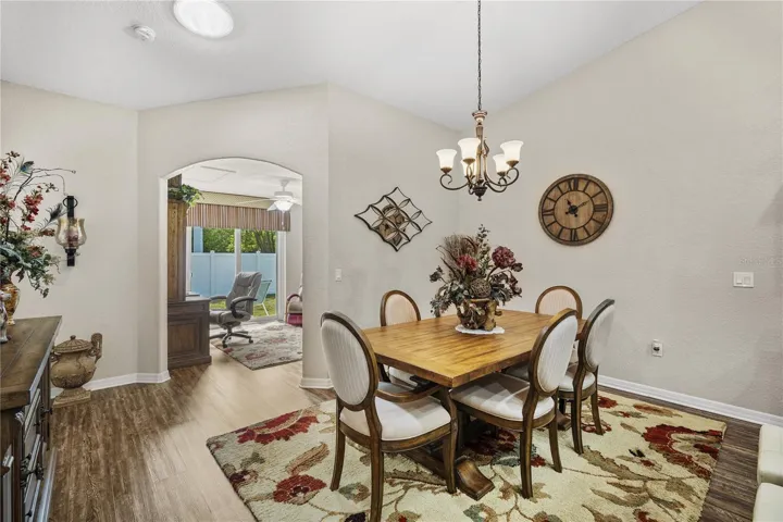 Dining room with archway to den